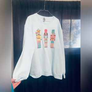 Susi Apparel Pastel Blue Sweatshirt with Nutcracker Motif